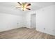 Cozy bedroom featuring neutral walls, ceiling fan, and modern vinyl flooring at 149 Hutson Ln, Clayton, NC 27527