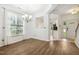 Dining area featuring wood flooring, a chandelier, and a view into the kitchen at 149 Hutson Ln, Clayton, NC 27527