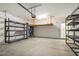 Well-lit garage with metal shelving, garage door opener, and a storage platform for your convenience at 149 Hutson Ln, Clayton, NC 27527