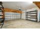 Spacious garage with concrete floors and metal shelving for easy organization of your belongings at 149 Hutson Ln, Clayton, NC 27527