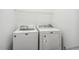 Laundry room with a white Maytag washing machine and dryer at 149 Hutson Ln, Clayton, NC 27527