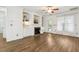 Comfortable living room featuring fireplace, built-in shelving, and wood flooring at 149 Hutson Ln, Clayton, NC 27527