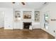 Inviting living room features a fireplace with built-in shelving and cabinetry at 149 Hutson Ln, Clayton, NC 27527