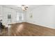 Bright living room with a back door, wood floors, and fan at 149 Hutson Ln, Clayton, NC 27527