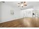 Spacious living room with wood floors, fan, and ample natural light at 149 Hutson Ln, Clayton, NC 27527