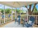 Inviting screened porch with comfortable seating and view of the backyard at 149 Hutson Ln, Clayton, NC 27527
