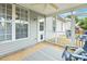 Relaxing screened patio with ceiling fan and a view of the private backyard at 149 Hutson Ln, Clayton, NC 27527