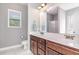 Bathroom featuring a double vanity and a walk-in shower at 174 Tafton Dr, Wendell, NC 27591