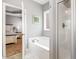 Bathroom featuring a soaking tub and glass door shower at 174 Tafton Dr, Wendell, NC 27591