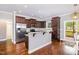 Kitchen featuring stainless appliances, gray backsplash, and bar seating area at 174 Tafton Dr, Wendell, NC 27591