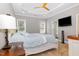 Spacious primary bedroom with a tray ceiling, ceiling fan, and carpeted floor at 174 Tafton Dr, Wendell, NC 27591