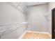 A walk-in closet with installed shelving and carpeted flooring at 174 Tafton Dr, Wendell, NC 27591