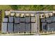 An aerial view shows homes with backyard parking pads with their roofs and their positioning on a cul-de-sac at 190 Wendover Pkwy, Pittsboro, NC 27312