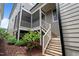Back porch featuring white wood railings, a ceiling fan, and direct access to the backyard at 190 Wendover Pkwy, Pittsboro, NC 27312