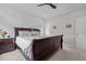 Comfortable bedroom featuring a wooden bed frame, neutral-toned bedding, and subtle wall decor for a peaceful retreat at 190 Wendover Pkwy, Pittsboro, NC 27312