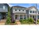 A craftsman-style home has a rocking chair front porch and professional landscaping in the front yard at 190 Wendover Pkwy, Pittsboro, NC 27312