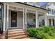 Inviting front porch featuring brick stairs, columns, and seating area at 190 Wendover Pkwy, Pittsboro, NC 27312