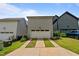 Detached two-car garage with a clean white door, adjacent to the home at 190 Wendover Pkwy, Pittsboro, NC 27312