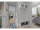 Inviting hallway with mudroom-style storage, light wood floors, and neutral color scheme at 190 Wendover Pkwy, Pittsboro, NC 27312