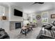 Cozy living room featuring a modern fireplace, TV and comfortable seating at 190 Wendover Pkwy, Pittsboro, NC 27312