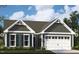 Charming home with a welcoming exterior, complete with a two-car garage and dark-colored shutters at 2000 Kapalua Way # 187, Durham, NC 27703