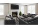 Cozy living room with a fireplace, comfortable seating, and large windows for natural light at 2000 Kapalua Way # 187, Durham, NC 27703