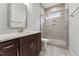 Modern bathroom featuring granite countertop vanity, a glass enclosed shower, and stylish tile flooring at 2028 Pleasant Forest Way, Wake Forest, NC 27587