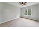 Bright bedroom featuring a large window and a ceiling fan at 2028 Pleasant Forest Way, Wake Forest, NC 27587