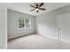 Comfortable bedroom with a ceiling fan and a large window providing a view of the outdoors at 2028 Pleasant Forest Way, Wake Forest, NC 27587