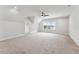 Expansive bonus room with plush carpeting, recessed lighting, and a bright window overlooking the neighborhood at 2028 Pleasant Forest Way, Wake Forest, NC 27587