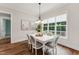 Bright dining area with large window and modern light fixture at 2028 Pleasant Forest Way, Wake Forest, NC 27587