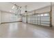 Spacious garage with epoxy flooring and two-car garage doors at 2028 Pleasant Forest Way, Wake Forest, NC 27587