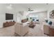 Spacious living room featuring stylish furniture, a ceiling fan, and a large window for ample natural light at 2028 Pleasant Forest Way, Wake Forest, NC 27587