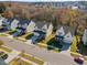 An aerial street view of gray and white homes, displaying their well maintained lawns and trees at 204 Woodstaff Ave, Wake Forest, NC 27587