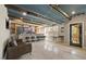 Open-concept basement bar featuring custom-built counter, stools, and ample room to entertain guests at 204 Woodstaff Ave, Wake Forest, NC 27587