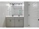 Bright bathroom with double vanity sinks, modern fixtures, and elegant white cabinetry at 204 Woodstaff Ave, Wake Forest, NC 27587