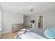 Bright bedroom with hardwood floors and a light color palette, complimented by a vanity at 204 Woodstaff Ave, Wake Forest, NC 27587