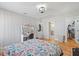 Comfortable bedroom with hardwood floors, bright decor, and ample natural light at 204 Woodstaff Ave, Wake Forest, NC 27587