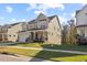Well-maintained two-story home with a covered front porch and a beautiful lawn at 204 Woodstaff Ave, Wake Forest, NC 27587