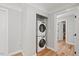 Convenient laundry room with stacked washer and dryer units at 204 Woodstaff Ave, Wake Forest, NC 27587