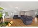 Bright living room featuring hardwood floors, a comfortable couch, and stylish decor at 204 Woodstaff Ave, Wake Forest, NC 27587
