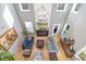 Spacious living room with fireplace, hardwood floors, and vaulted ceilings with lots of natural light at 204 Woodstaff Ave, Wake Forest, NC 27587