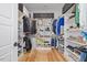 Organized walk-in closet with shelving, hanging racks, and storage boxes at 204 Woodstaff Ave, Wake Forest, NC 27587
