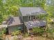 Aerial view of home with screened porch and wooded lot at 207 Old Forest Creek Dr, Chapel Hill, NC 27514