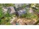 Aerial view of the backyard showing a swing set and lush landscaping at 207 Old Forest Creek Dr, Chapel Hill, NC 27514