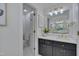 Beautiful bathroom featuring marble countertops, black cabinets, and modern fixtures at 207 Old Forest Creek Dr, Chapel Hill, NC 27514