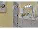 Bright bathroom with framed mirror, tiled floors, and double sink vanity at 207 Old Forest Creek Dr, Chapel Hill, NC 27514