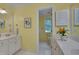 Bathroom with large white counters, cabinets and doorway leading to the toilet and shower at 207 Old Forest Creek Dr, Chapel Hill, NC 27514