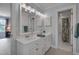 Classic bathroom featuring a white vanity, framed mirror, and a shower-tub combination at 207 Old Forest Creek Dr, Chapel Hill, NC 27514
