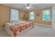 Comfortable bedroom with hardwood floor, soft lighting, and a large bed at 207 Old Forest Creek Dr, Chapel Hill, NC 27514